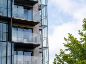 Contemporary balconies framed by greenery